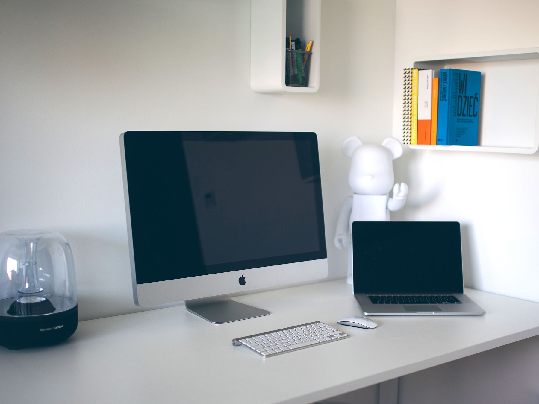 An engineering workspace with desktop and laptop screens